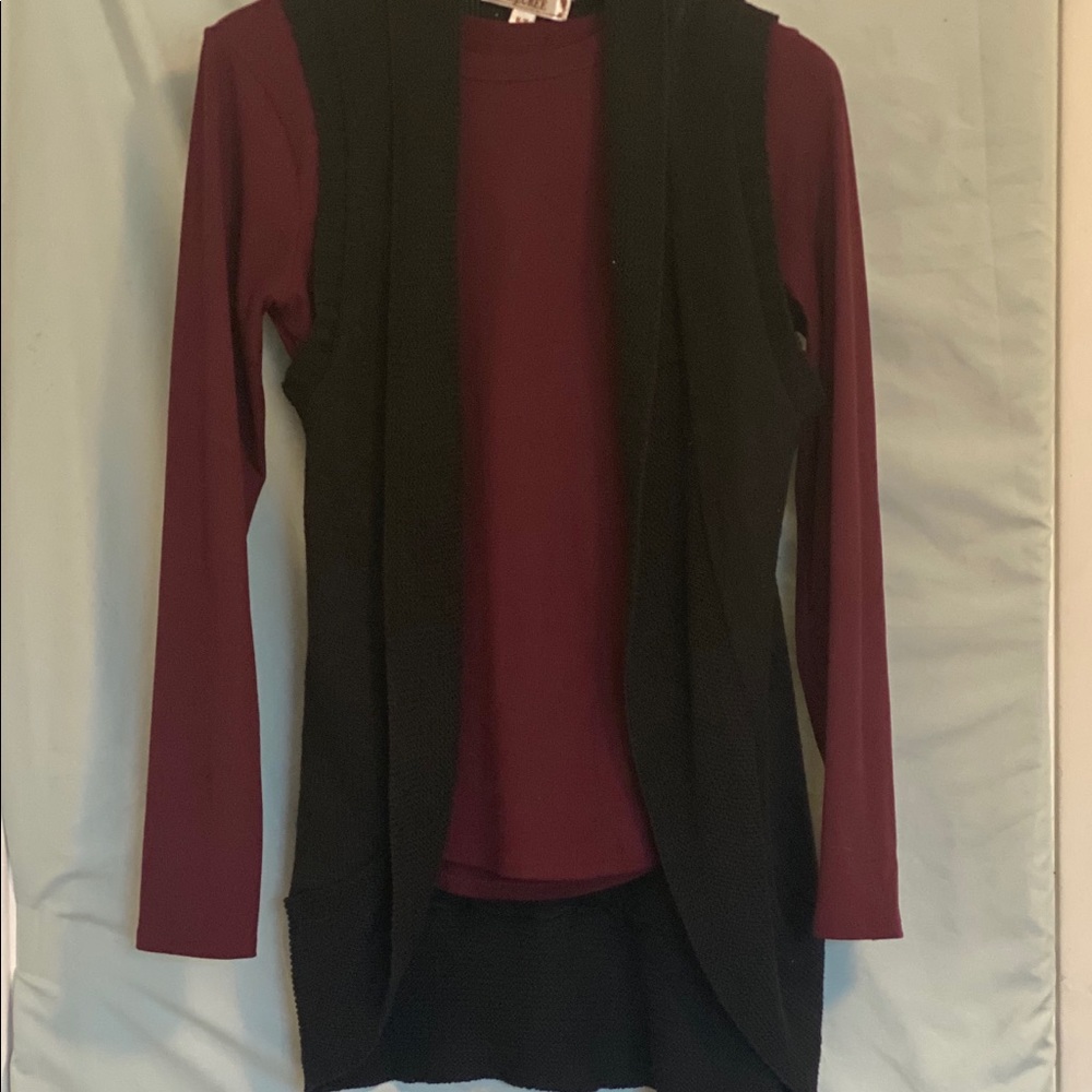 Black sleeveless throw over sweater.